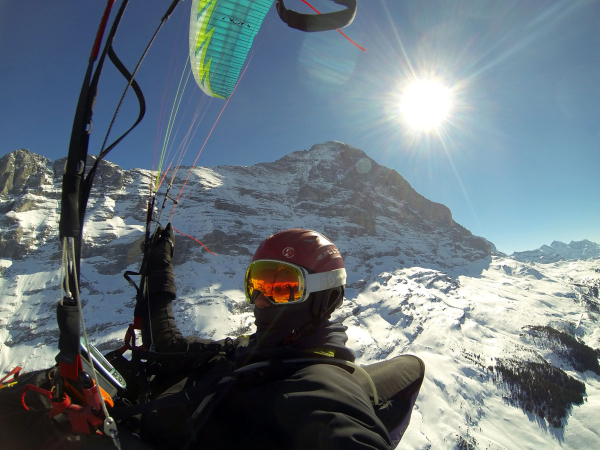 paragliding pilot sun flight